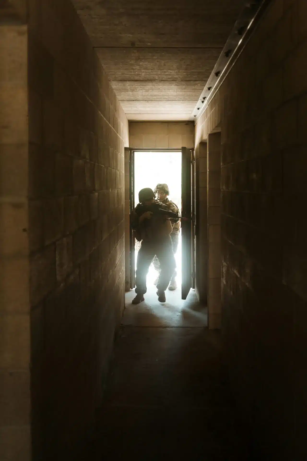 Military sqaud entering a building